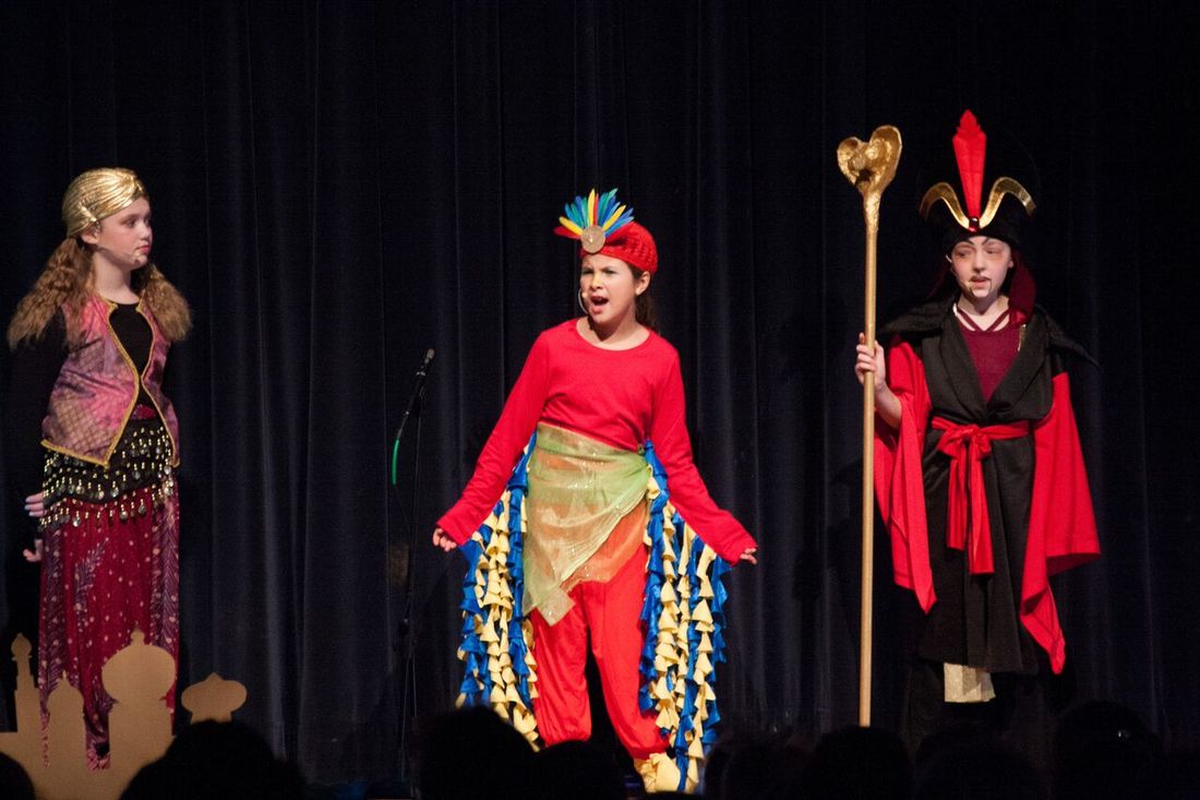 Cast of Aladdin performing.